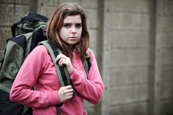 homeless teen girl one street with backpack